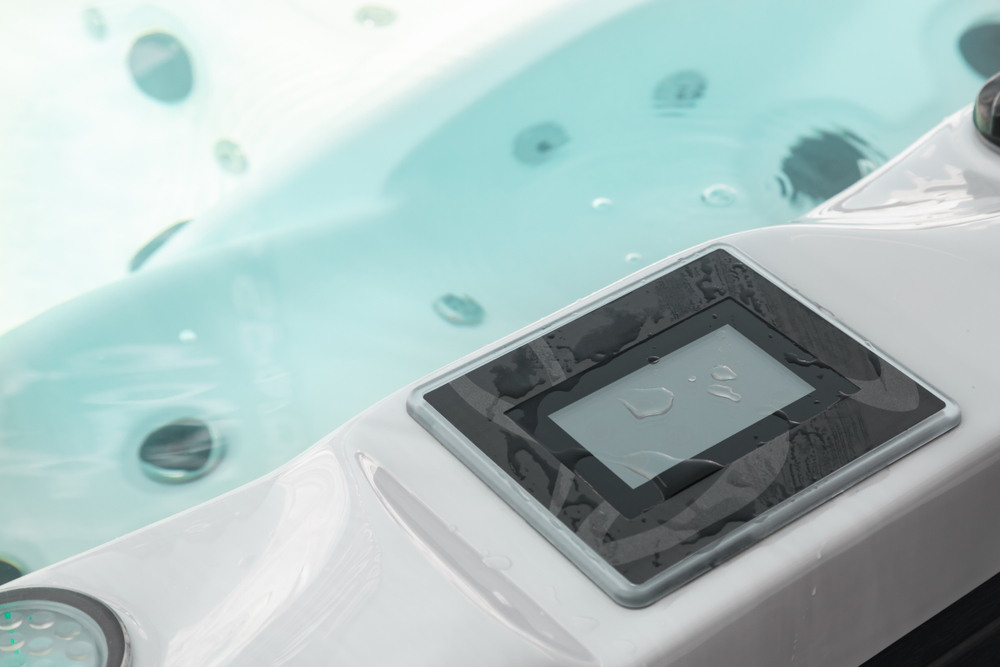 Accessorized spa oasis with a hydrotherapy tub and outdoor elements.