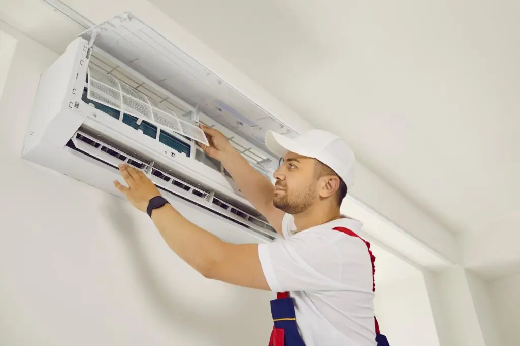 Air,Conditioning,System.,Professional,Male,Technician,Installs,Indoor,Air,Conditioner
